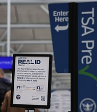 A sign outside a TSA checkpoint at Chicago O'Hare International Airport informs travelers of the REAL ID deadline.
Mandatory Credit:	Aaron M. Sprecher/AP via CNN Newsource