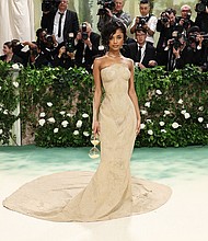 Tyla’s sculpted sand gown, created by Balmain from a plaster mold of her body, was one of the most talked-about looks of 2024. The singer had to be lifted up the stairs to the entrance of the Met.
Mandatory Credit:	Jamie McCarthy/Getty Images via CNN Newsource