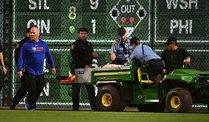 A fan is carted off the field after falling from the stands at PNC Park.
Mandatory Credit: