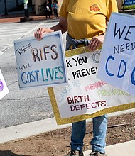 People protest outside of the Centers for Disease Control and Prevention in Atlanta on Tuesday, April 1 after layoffs were announced.
Mandatory Credit:	Ben Gray/AP via CNN Newsource