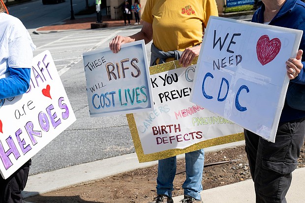 People protest outside of the Centers for Disease Control and Prevention in Atlanta on Tuesday, April 1 after layoffs were announced.
Mandatory Credit:	Ben Gray/AP via CNN Newsource