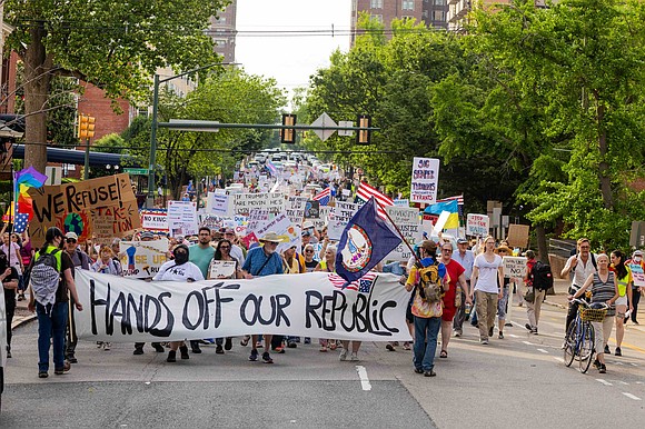 Chants echoed through downtown Richmond on May Day as more than a thousand demonstrators marched down Franklin Street in support … Chants echoed through downtown Richmond on May Day as more than a thousand demonstrators marched down Franklin Street in support …