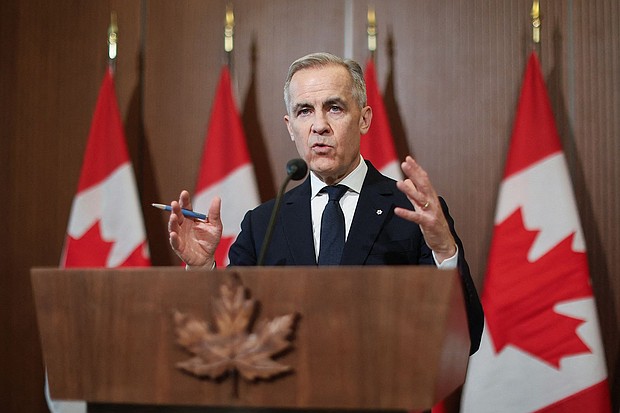 Canada's Prime Minister Mark Carney speaks at a news conference about the US tariffs on Parliament Hill in Ottawa on April 3.
Mandatory Credit:	Dave Chan/AFP/Getty Images via CNN Newsource