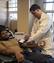 U.S. Army Staff Sgt. Marcos Flores, right, from San Bernardino, California, draws blood from Aviation Boatswain’s Mate (Aircraft Handling) 3rd Class Camriyon Smith, from Houston, during a blood drive in the Fleet Logistics Center building at Naval Base Kitsap-Bremerton, Washington, May 6, 2025. Ronald Reagan is undergoing scheduled maintenance at Puget Sound Naval Shipyard and Intermediate Maintenance Facility while remaining a combat-ready force dedicated to protecting and defending the United States. (U.S. Navy photo by Aviation Electronics Technician 3rd Class Benjamin Hurner)