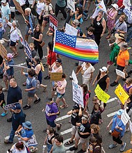 The protest began at 5 p.m. with a rally in Monroe Park, followed by a march to Capitol Square.