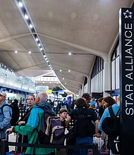 People wait in line for a delayed flight at Newark International Airport on May 5, 2025
Mandatory Credit:	Spencer Platt/Getty Images via CNN Newsource