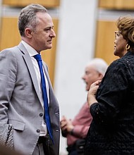 Superintendent Jason Kamras chats with 6th District Councilor Ellen Robertson on Thursday, March 27,  at City Hall.                         photo byShaban Athuman/ VPM News