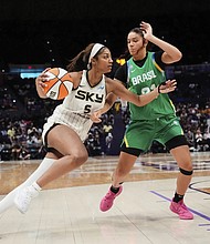 Chicago Sky forward Angel Reese (5) drives to the basket against Brazil forward Manu Alves in the second half of a WNBA exhibition game in Baton Rouge, La.