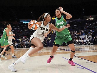 Chicago Sky forward Angel Reese (5) drives to the basket against Brazil forward Manu Alves in the second half of a WNBA exhibition game in Baton Rouge, La.
