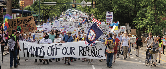 Chants echoed through downtown Richmond on Thursday, May 1 as more than a thousand demonstrators marched down Franklin Street in … Chants echoed through downtown Richmond on Thursday, May 1 as more than a thousand demonstrators marched down Franklin Street in …