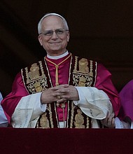 Newly elected Pope Leo XIV appears at the balcony of St. Peter's Basilica at the Vatican on Thursday, May 8, 2025.
Mandatory Credit:	Andrew Medichini/AP via CNN Newsource