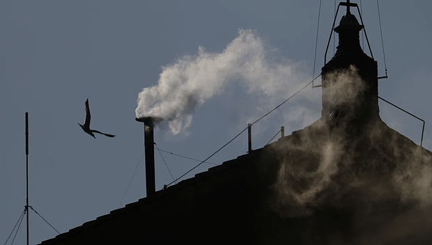White smoke rises from the chimney on the Sistine Chapel, indicating that a new pope has been elected at the Vatican, May 8, 2025.
Mandatory Credit:	Hannah McKay/Reuters via CNN Newsource