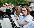Members of the Richmond Concert Band play to an outdoor crowd during a recent concert at Agecroft Hall and Gardens.