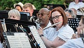 Members of the Richmond Concert Band play to an outdoor crowd during a recent concert at Agecroft Hall and Gardens.