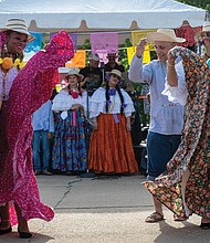 Jacqueline Anthony and Xiomara Holt of the Panamanian Traditional Dance Group, a non-profit dedicated to preserving and promoting the folkloric dance traditions of Panama, performed at the ¿Qué Pasa? Festival on Brown’s Island, May 3.