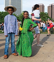 Austen Anthony and Asia Anthony, of the Panamanian Traditional Dance Group, pose during the ¿Qué Pasa? Festival on Brown’s Island, May 3. Proceeds from the event support the Virginia Hispanic Chamber and the Virginia Hispanic Foundation.