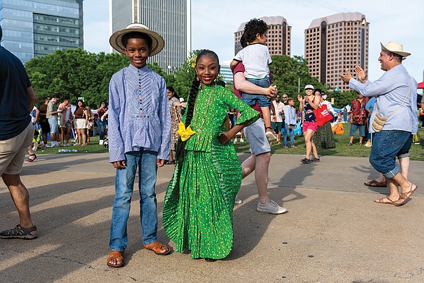 Austen Anthony and Asia Anthony, of the Panamanian Traditional Dance Group, pose during the ¿Qué Pasa? Festival on Brown’s Island, May 3. Proceeds from the event support the Virginia Hispanic Chamber and the Virginia Hispanic Foundation.