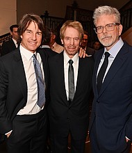 LONDON, ENGLAND - MAY 12: (L to R) Tom Cruise, Jerry Bruckheimer and Christopher McQuarrie attend the BFI Chair's dinner where Tom Cruise was awarded a BFI Fellowship at The Rosewood on May 12, 2025 in London, England. ..Photo by Dave Benett