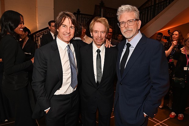 LONDON, ENGLAND - MAY 12: (L to R) Tom Cruise, Jerry Bruckheimer and Christopher McQuarrie attend the BFI Chair's dinner where Tom Cruise was awarded a BFI Fellowship at The Rosewood on May 12, 2025 in London, England. ..Photo by Dave Benett