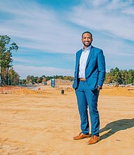 Jovan Burton, executive director of the Partnership for Housing Affordability, stands at
the Parkside Townes development site in Sandston.