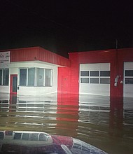 A flooded Valley Auto Spa sits in Big Stone Gap after Hurricane Helene passed through the area in 2018. It was one of many buildings affected by the storm.