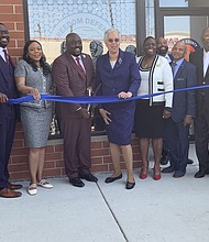 Community stakeholders and elected officials during the ribbon cutting for the Freedom Defense Center of Roseland. Photo by Tia Carol Jones.