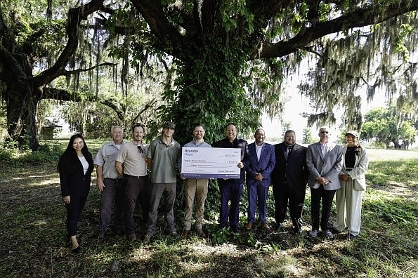 (left to right) Ciara Calub, corporate social responsibility, Hyundai Motor North America, Russ Webb, wildlife refuge manager, U.S. Fish and Wildlife Service, Nathan Hawkaluk, deputy project leader, U.S. Fish & Wildlife Service, Jake Merendino, biologist, Ducks Unlimited, Chad Ledford, director of development, Ducks Unlimited, Brandon Ramirez, director, corporate social responsibility, Hyundai Motor North America, Jason York, regional parts and service, southern region, Hyundai Motor America, Jason Blankenship, district parts and service, southern region, Hyundai Motor America, Doug Bush, dealer network development, southern region, Hyundai Motor America, Vanessa Perez, corporate social responsibility, Hyundai Motor North America at Savannah National Wildlife Refuge in Hardeeville, S.C. on May 14, 2025 (Photo/Hyundai)