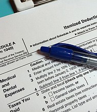 The state and local tax deduction can only be taken on the federal income tax return by those who itemize their deductions, which only a minority of filers do.
Mandatory Credit:	Lisa J. Goodman/Moment Mobile RF/Getty Images via CNN Newsource