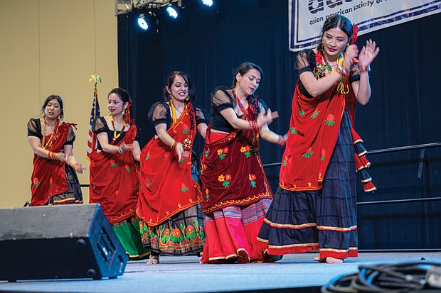 Women from the Nepali community perform a traditional Himalayan dance during the Asian American Festival at the Greater Richmond Convention Center on May 16.