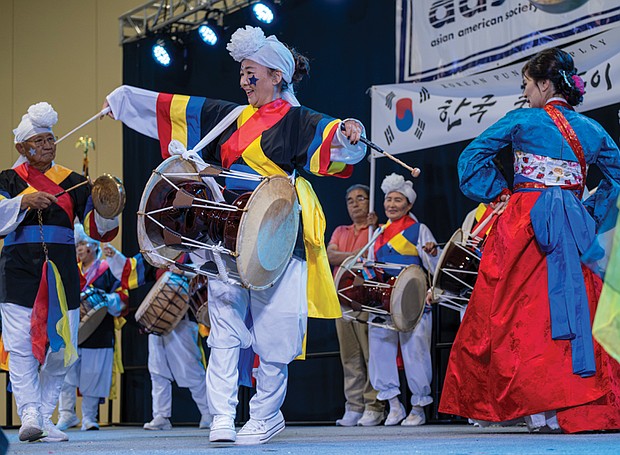 Members of the Korean community celebrate during the annual event, which has been held for more than 25 years, that showcases the cultures, traditions and cuisines of Asian American communities across the region.