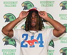 Huguenot High School linebacker Markel Dabney dons an SMU cap after committing to Southern Methodist University. Dabney is the first linebacker to pledge to SMU’s 2026 recruiting class.