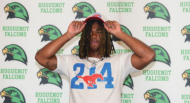 Huguenot High School linebacker Markel Dabney dons an SMU cap after committing to Southern Methodist University. Dabney is the first linebacker to pledge to SMU’s 2026 recruiting class.