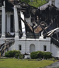 Crews remain on scene after a fire engulfed the historic Nottoway Plantation, Friday, May 16, 2025, in White Castle, La.