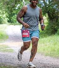 Aubrey Rankin III, runs to the finish of the Bust the Banks Half Marathon trail run. Banks, along with other participants navigated approximately 13.1 miles of Richmond’s urban single-track trails along the James River.