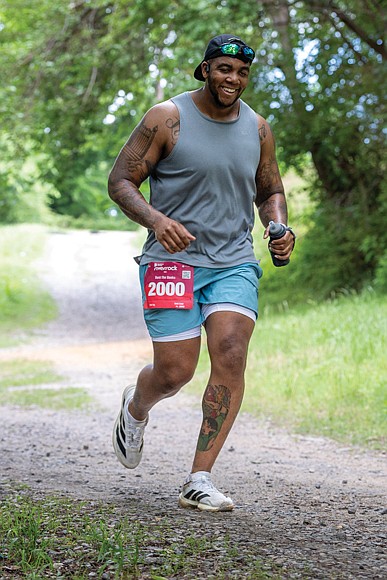 Aubrey Rankin III, runs to the finish of the Bust the Banks Half Marathon trail run. Banks, along with other participants navigated approximately 13.1 miles of Richmond’s urban single-track trails along the James River.