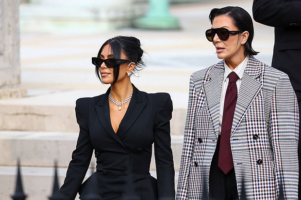 Kim Kardashian, accompanied by Kris Jenner, leaves the courthouse of the trial of 10 people accused of stealing millions of dollars worth of jewellery from her, in Paris, France, on May 13.
Mandatory Credit:	Piroschka Van De Wouw/Reuters via CNN Newsource