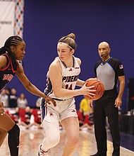 Richmond’s Ally Sweeney (14) controls the ball during a 63-58 win over Duquesne in Game 8 of the A-10 Women’s Basketball Championship on Friday, March 7, at the Henrico Sports & Events Center. The tournament will remain in Henrico through 2027 under a new Atlantic 10 deal.