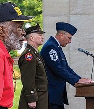 U.S. Navy veteran Henry Mack stands in solemn reflection as the names of nearly 12,000 Virginians who died in battle from World War II to the present are read aloud during the inaugural “Say Their Names Marathon” at the Virginia War Memorial on Monday, May 26.