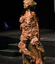 Asani Ka-Re, a 12th-grader at Meadowbrook High School, models her design inspired by Sand Hills in Grünau during the Teen Stylin’ 2025: Authenticity event at the Virginia Museum of Fine Arts on May 4.