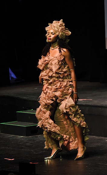 Asani Ka-Re, a 12th-grader at Meadowbrook High School, models her design inspired by Sand Hills in Grünau during the Teen Stylin’ 2025: Authenticity event at the Virginia Museum of Fine Arts on May 4.