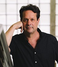 Professor Kevin Prufer, the Texas State Poet Laureate for 2026, poses for a portrait inside his office in Roy G. Cullen Building.