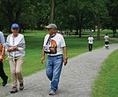 William and Robin Allman walk and talk with Team Hind organizer Adeeb Abed along the Vita Course Trail during Saturday’s Gaza solidarity walkathon in Byrd Park. The event raised funds for mental health support for Palestinian children.