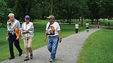 William and Robin Allman walk and talk with Team Hind organizer Adeeb Abed along the Vita Course Trail during Saturday’s Gaza solidarity walkathon in Byrd Park. The event raised funds for mental health support for Palestinian children.
