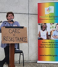 Health Brigade Executive Director Karen Legato speaks at a town hall on May 29 to discuss state and federal funding cuts to Virginia’s network of free clinics.