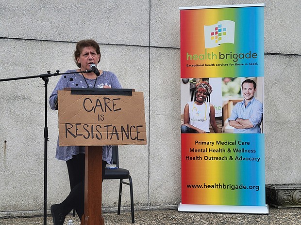 Health Brigade Executive Director Karen Legato speaks at a town hall on May 29 to discuss state and federal funding cuts to Virginia’s network of free clinics.