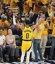 Indiana Pacers guard Tyrese Haliburton celebrates May 31 after a teammate made a 3-pointer during the second half of Game 6 of the Eastern Conference finals of the NBA basketball playoffs against the New York Knicks in Indianapolis.