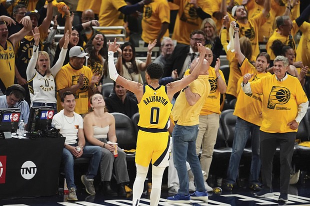 Indiana Pacers guard Tyrese Haliburton celebrates May 31 after a teammate made a 3-pointer during the second half of Game 6 of the Eastern Conference finals of the NBA basketball playoffs against the New York Knicks in Indianapolis.
