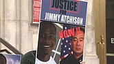 This image taken from video shows Jimmy Atchison’s family holding a vigil June 4 in Atlanta, insisting they get some answers three years after he was shot and killed when Atlanta police tried to arrest him.