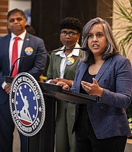 Narissa Rahaman, executive director of Equality Virginia, speaks during the event celebrating the raising of the Progress Pride Flag at City Hall.