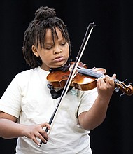 Qmaya-Leigh Owens, a Music Orchard Richmond and Peter Paul RVA participant, plays during the concert that showcased the talents of young musicians with one or more years of practice.